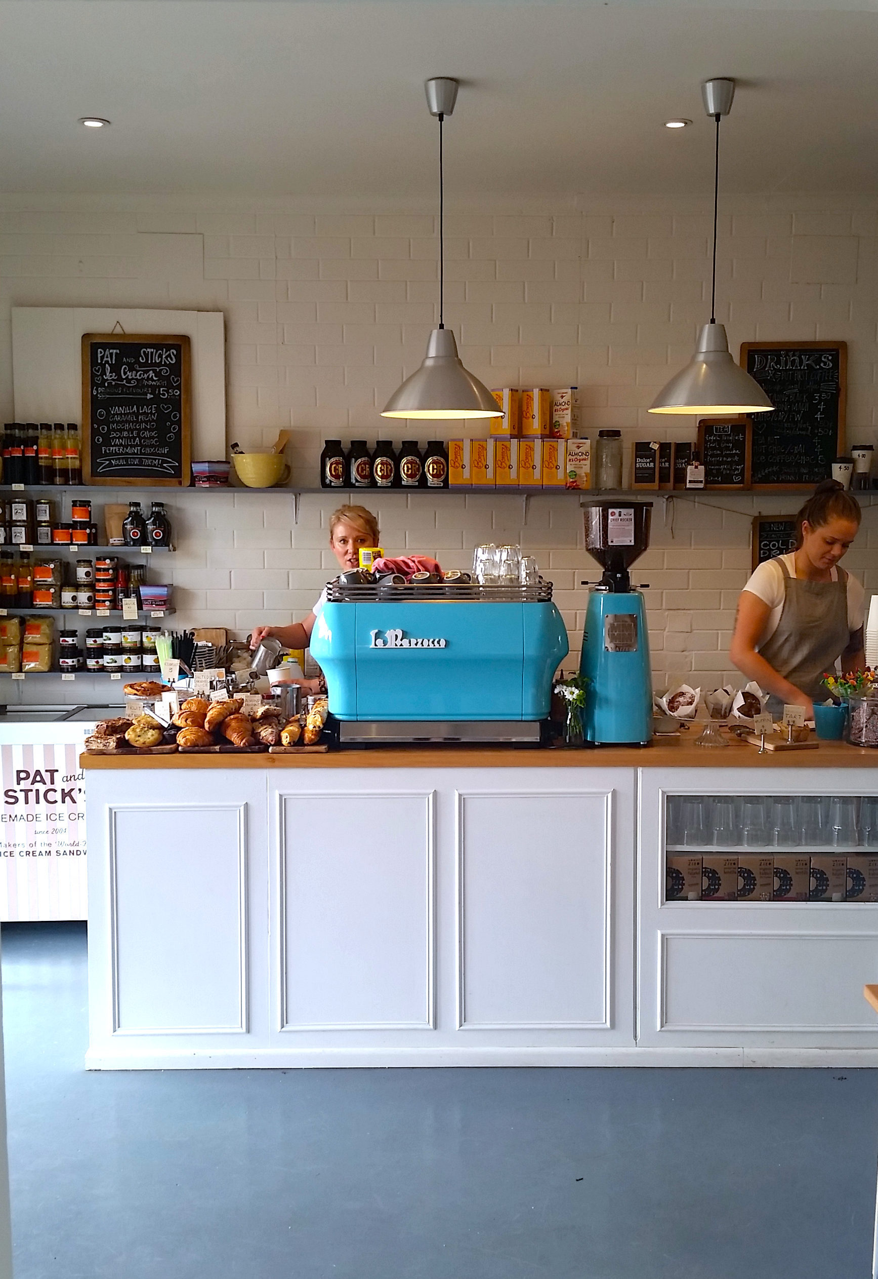 It's like I just walked into a Wes Anderson film with the candy-colored coffee machine!