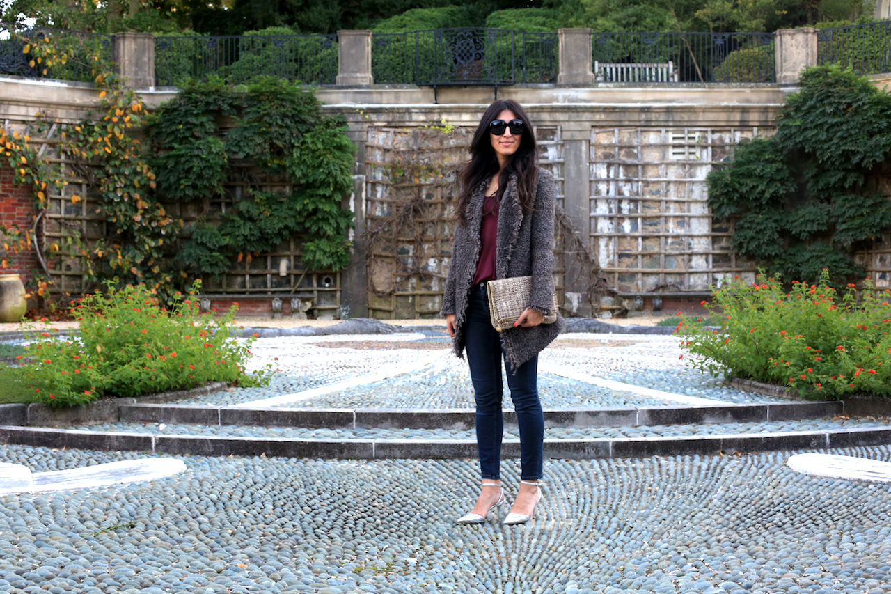 dumbarton-oaks-pebble-garden-iro-jacket-standing-not-smiling