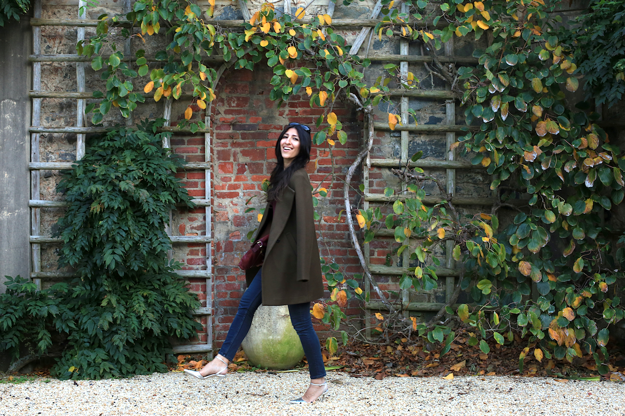 dumbarton-oaks-pebble-garden-ivy-wall-theory-jacket-laughing-walking